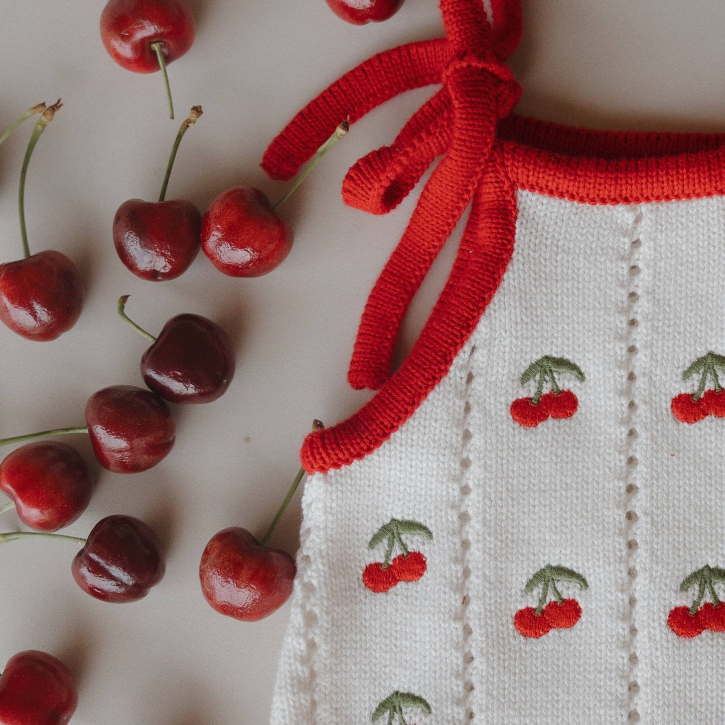 Cherry Knit Ruffle Romper